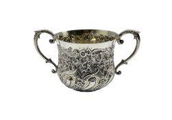 Victorian silver two handled porringer with embossed floral decoration and scroll handles