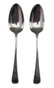 Pair of George III silver table spoons with later floral engraving London 1784 Maker George Smith II