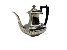 Late Victorian silver coffee pot with gadrooned edge and half body decoration with ebonised handle a