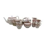 Spode red Fleur de Lys tea and coffee service comprising six tea cups and saucers