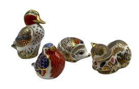 Four Royal Crown Derby paperweights comprising a Robin