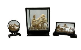 Chinese carved cork diorama scene depicting pavilion on lake with cranes in ebonised case together w