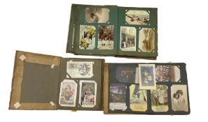 Post card album and contents including World War I Bamforth Songs cards