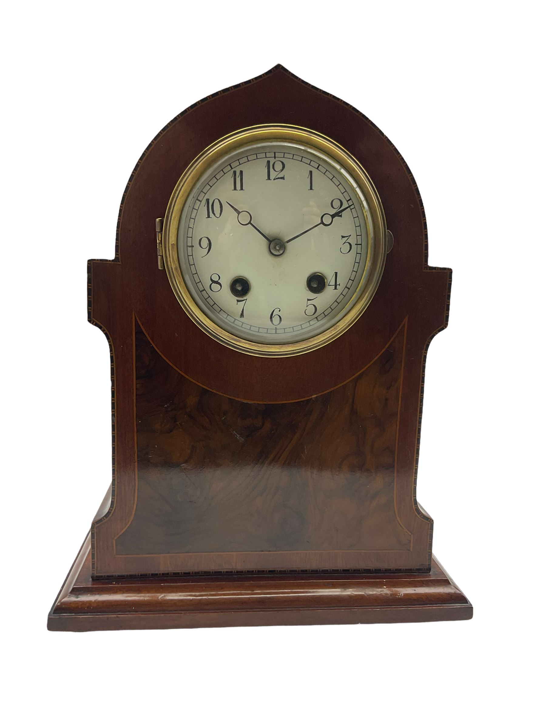 An Edwardian c1910 mahogany veneered mantle clock in a pointed arch case with inlaid satinwood strin
