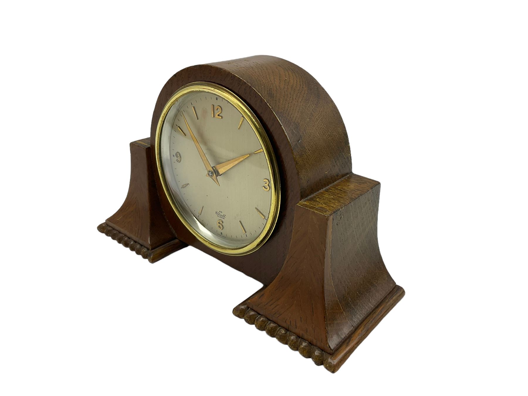 A small mid-20th century English made mantle clock in a round oak case with protruding side supports - Image 2 of 3