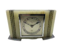 A 1950's rectangular white Onyx cased mantle clock retailed by Gerrard & Son