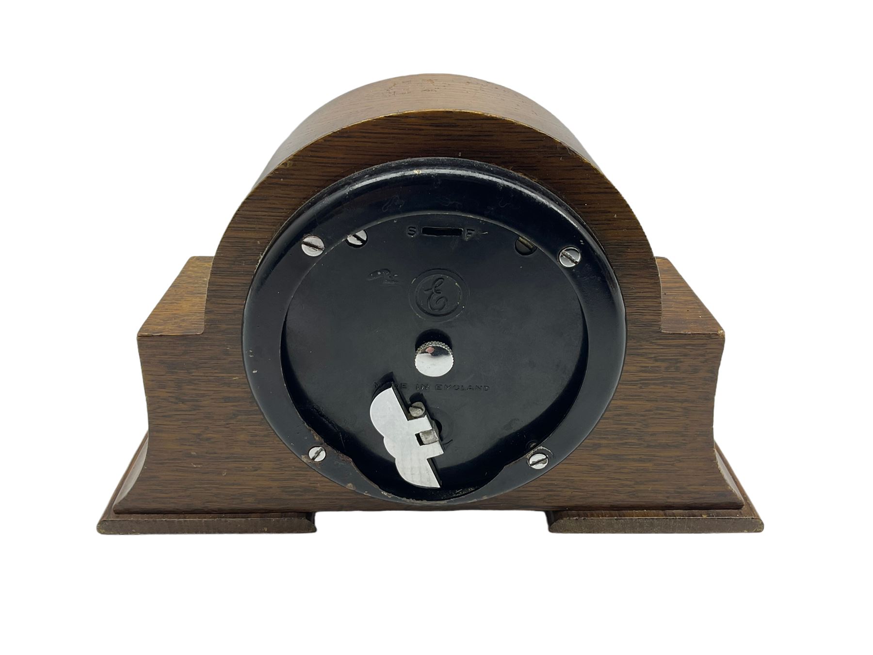 A small mid-20th century English made mantle clock in a round oak case with protruding side supports - Image 3 of 3