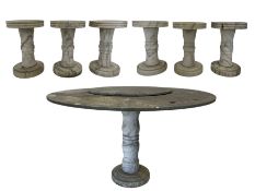 Circular marble garden table with six marble stools