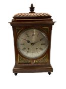 Winterhalder and Hoffmeier striking mantle clock in a mahogany case with a carved gadrooned top surm