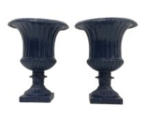 Pair of painted cast iron garden urns