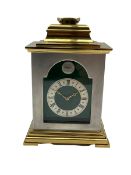 Thwaites and Reed twentieth century carriage clock in a brass and steel finished case with an invert