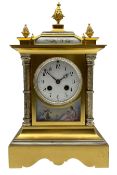 Early 20th century French mantle clock in a brass satin finished case with contrasting silvered deta