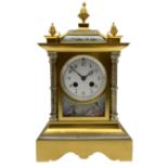 Early 20th century French mantle clock in a brass satin finished case with contrasting silvered deta