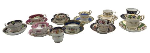 John Rose Coalport trio decorated with floral panel within a blue an gilt surround