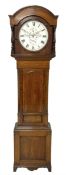 A mid-nineteenth century 8 day Oak longcase clock with a circular dial inscribed "JH Maughan