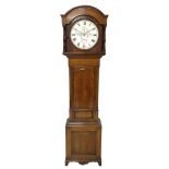 A mid-nineteenth century 8 day Oak longcase clock with a circular dial inscribed "JH Maughan