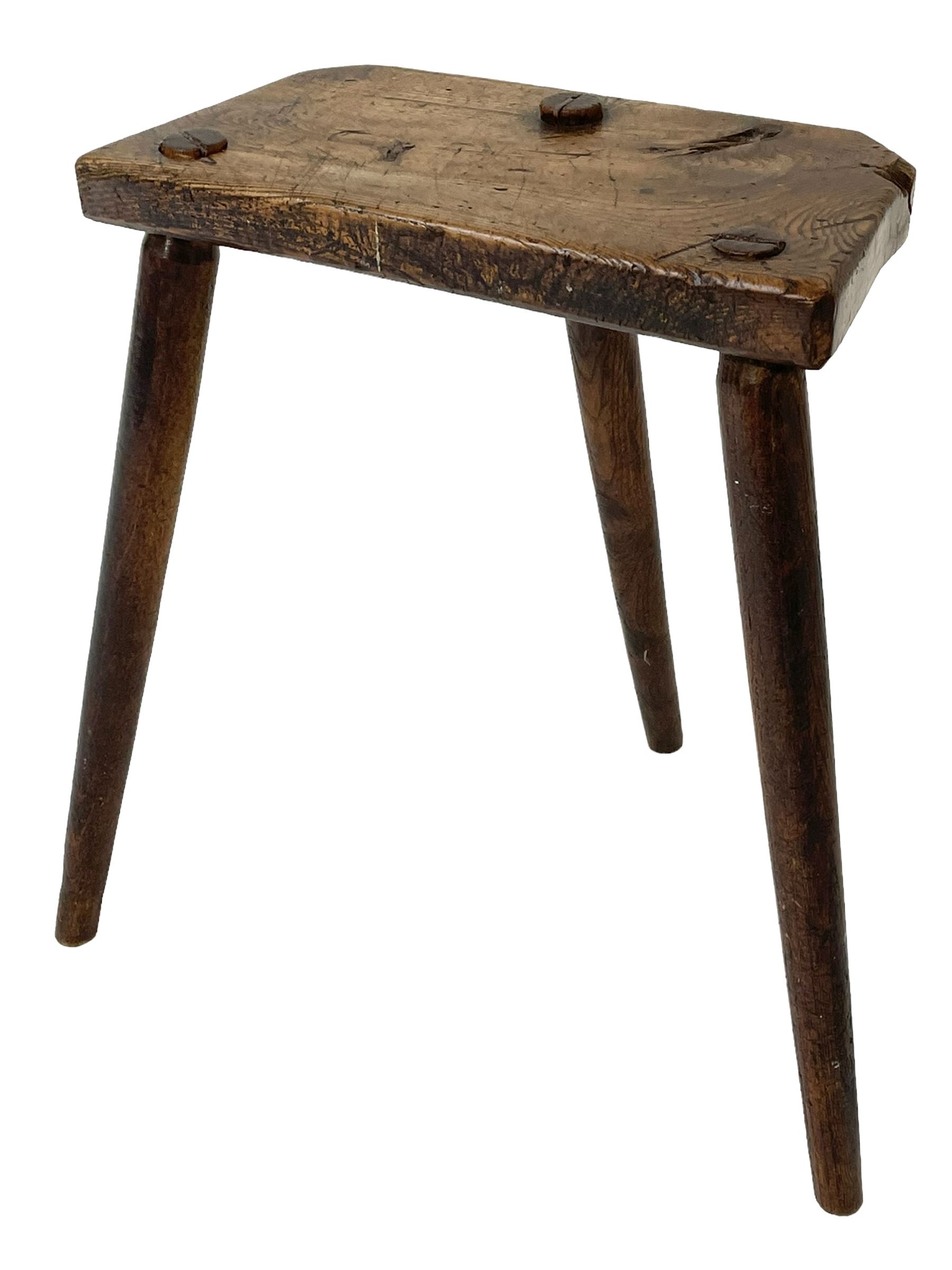 Early 19th century three-legged milking stool