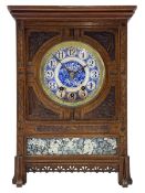 Carved oak cased 8-day striking and chiming mantle clock in the style of William Morris c1880