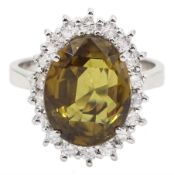 18ct white gold oval yellow/brown zircon and round brilliant cut diamond cluster ring