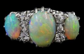 Early 20th century 18ct white gold three stone opal and six stone old cut diamond ring