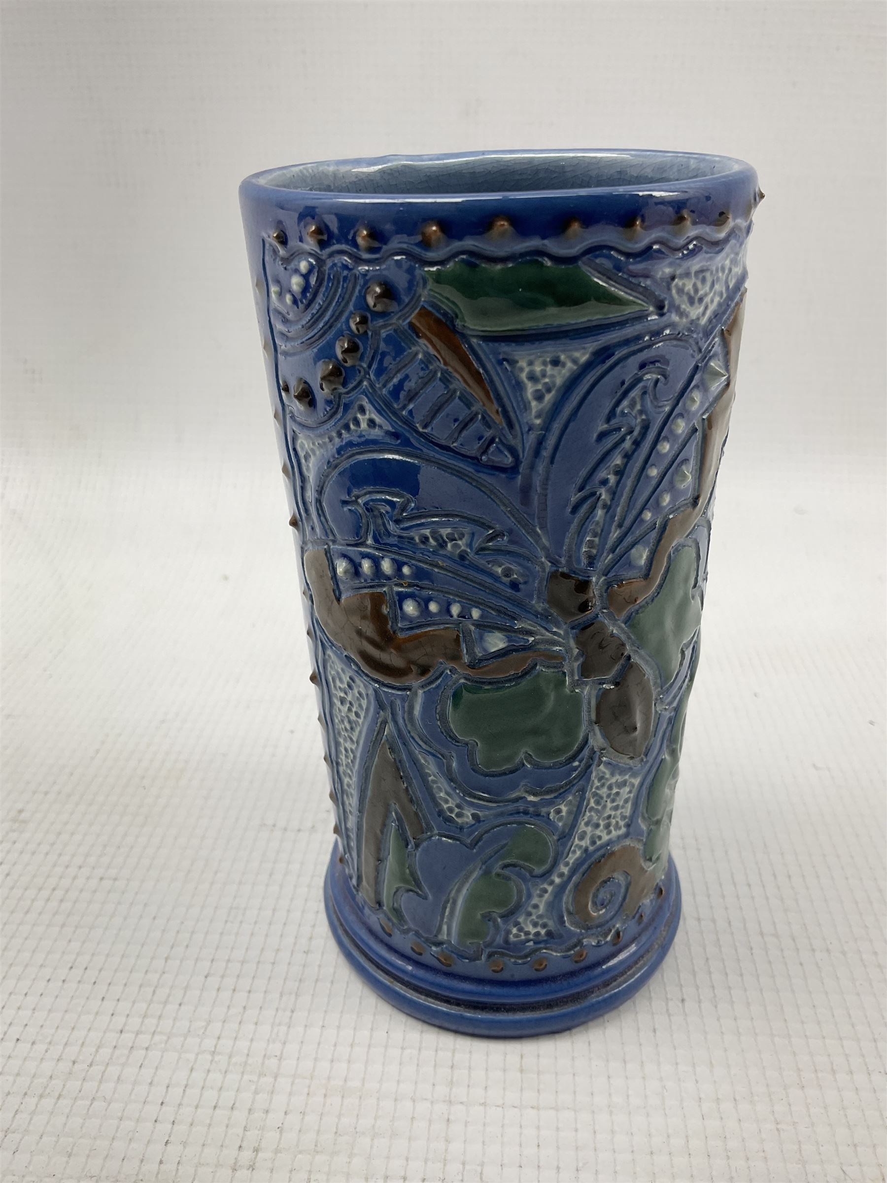 C H Brannam Barnstaple cylindrical vase decorated with stylised butterfly on a blue ground H13cm - Image 2 of 5