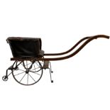 Victorian child's two wheeled dog cart with buttoned leather tub shape seat
