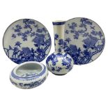 Pair of late 19th century Japanese blue and white chargers decorated with trees and birds D34cm