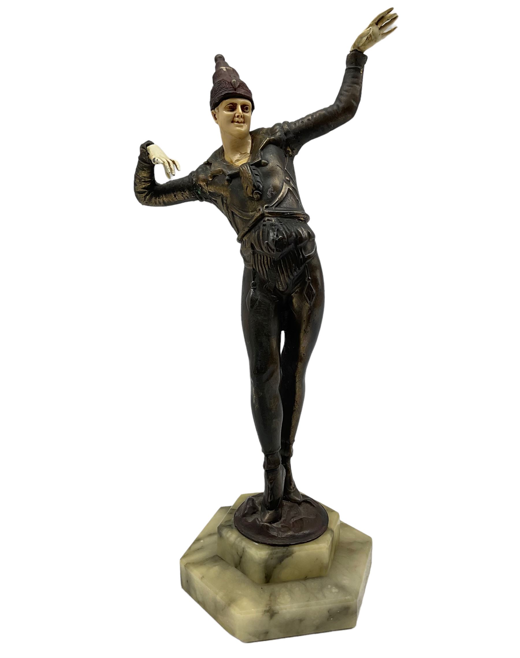 Art Deco style bronzed figure of a clown mounted on an onyx plinth
