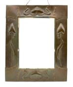 Art Nouveau upright wall mirror with bevelled plate and copper frame with a raised pattern of stylis