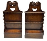 Pair of Georgian oak hanging spoon racks with pierced racks