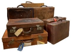 Four leather suitcases