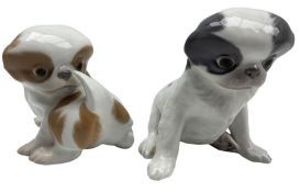 Royal Copenhagen model of a Pekingese dog in grey No. 448 together with another No. 445