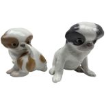 Royal Copenhagen model of a Pekingese dog in grey No. 448 together with another No. 445