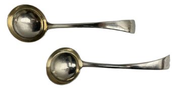 Pair of Edwardian silver sauce ladles engraved with initials London 1909 MakerJosiah Williams & Co
