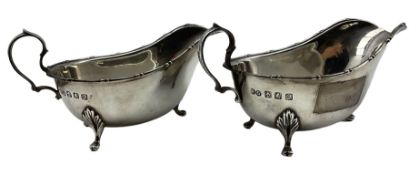 Pair of silver sauce boats with loop handles on triple shaped supports Glasgow 1913 Maker Robert Sco