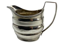 George III silver cream jug with reeded handle and rim