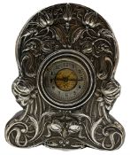 Leather and silver mounted timepiece of Art Nouveau design with raised pattern of stylised flowers a