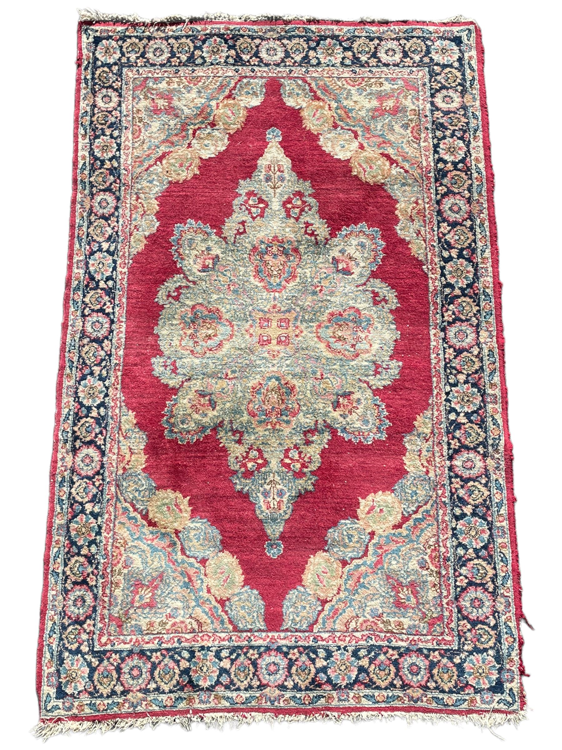 Small Persian red ground rug