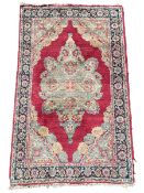 Small Persian red ground rug