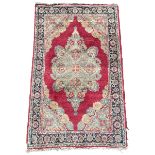 Small Persian red ground rug