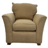 Armchair upholstered in beige fabric