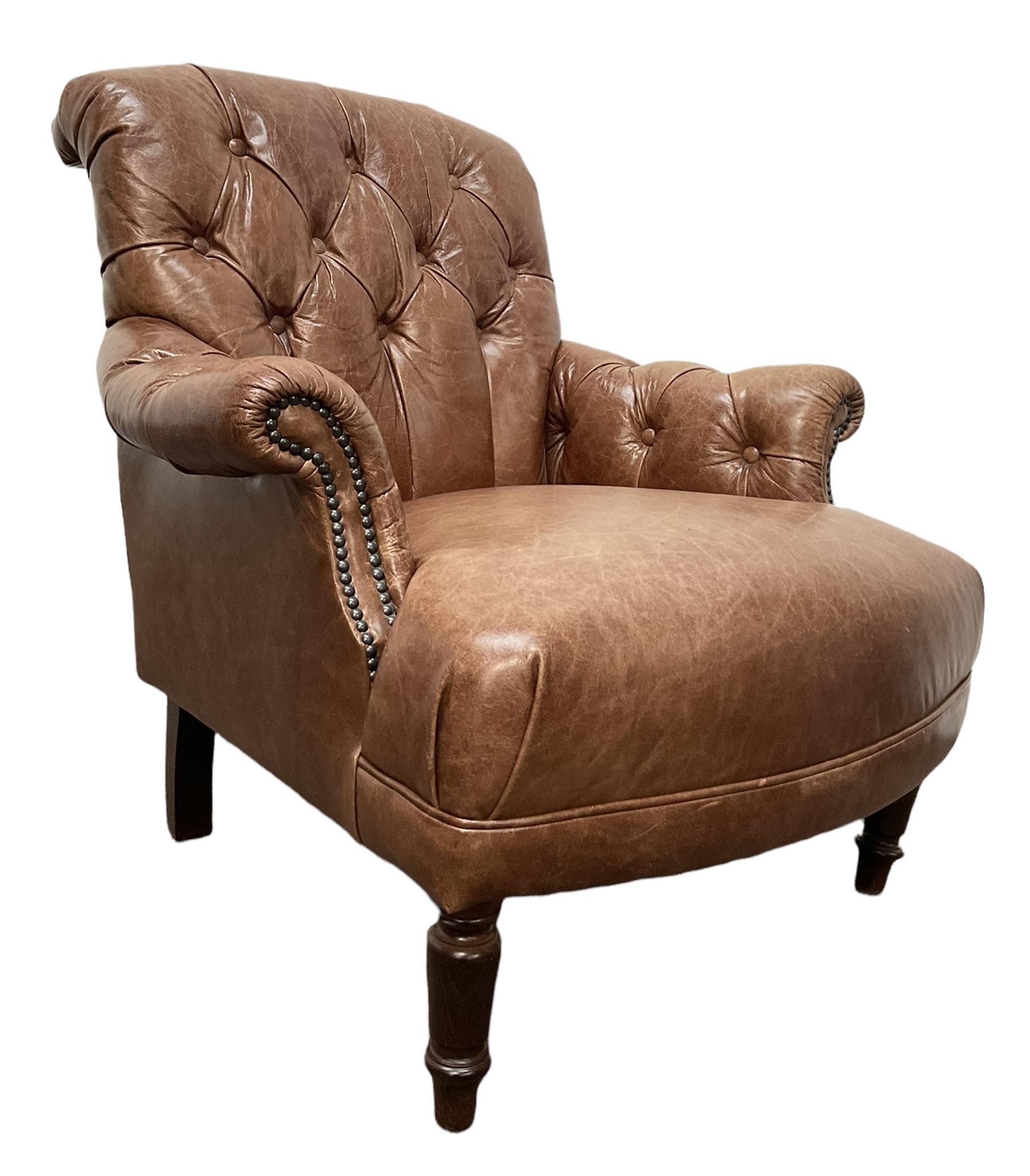 Tetrad - tub shaped armchair upholstered in buttoned tan leather