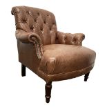 Tetrad - tub shaped armchair upholstered in buttoned tan leather