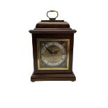 20th century mahogany cased table clock with a spring driven Elliott movement