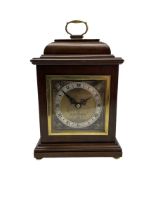 20th century mahogany cased table clock with a spring driven Elliott movement