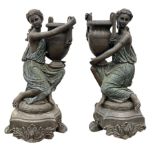 Pair statues of Classical Greek maidens holding amphorae urns with a bronzed finish