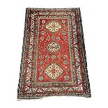 Persian red ground rug