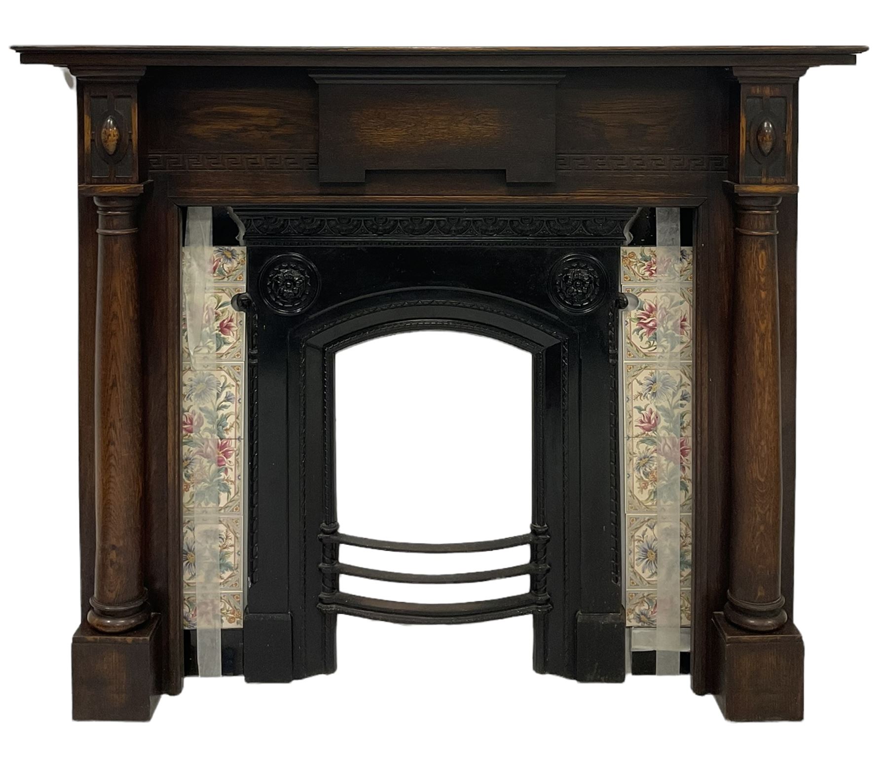 Oak fireplace with two carved columns and Greek keys
