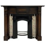 Oak fireplace with two carved columns and Greek keys