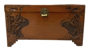 Carved camphor wood blanket box with oriental carved scenes